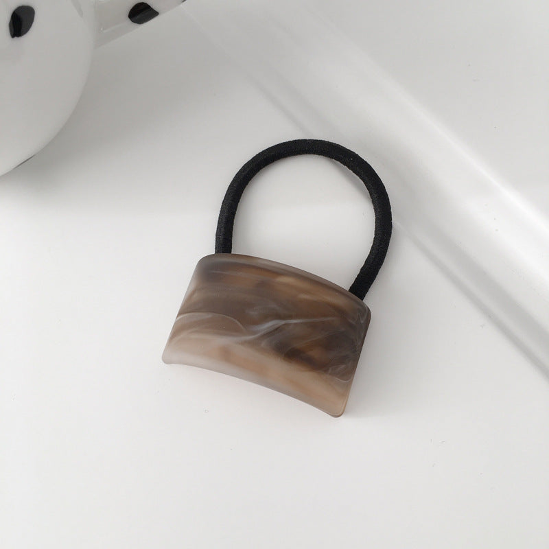 wood grain girl ponytail hair tie