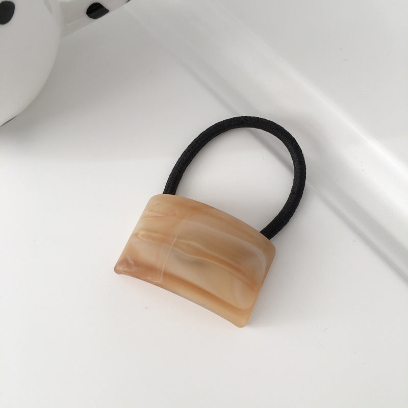 wood grain girl ponytail hair tie