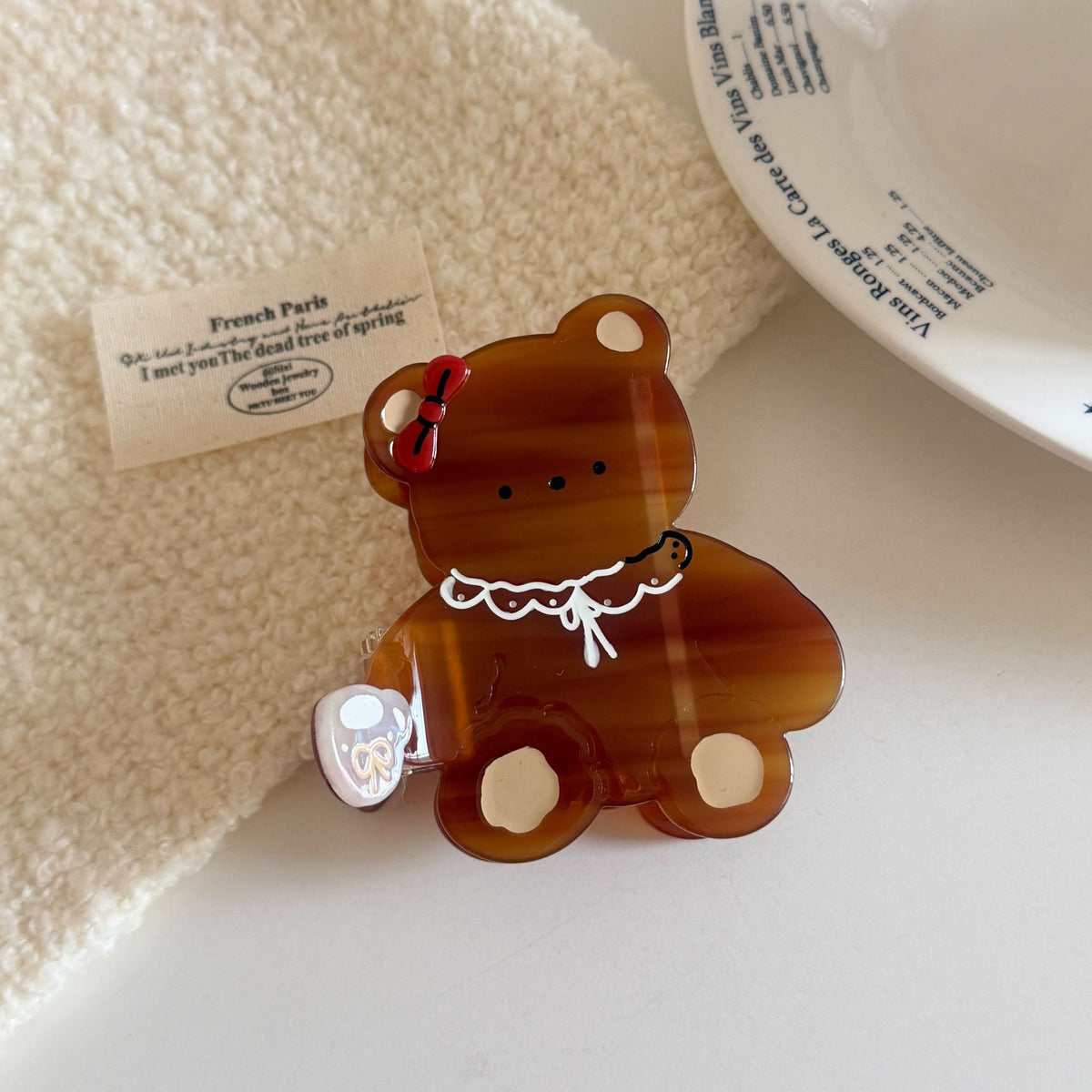 Cream cartoon bow tie bear hair claw