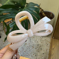 thickened irregular round bow hair claw