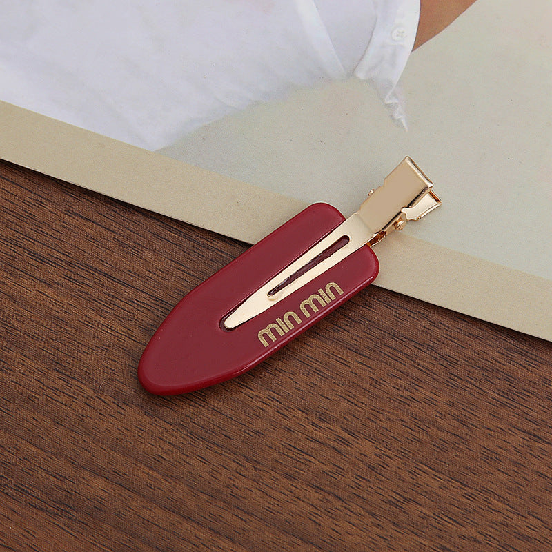Solid-color seamless hair clip for makeup application