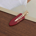 Solid-color seamless hair clip for makeup application