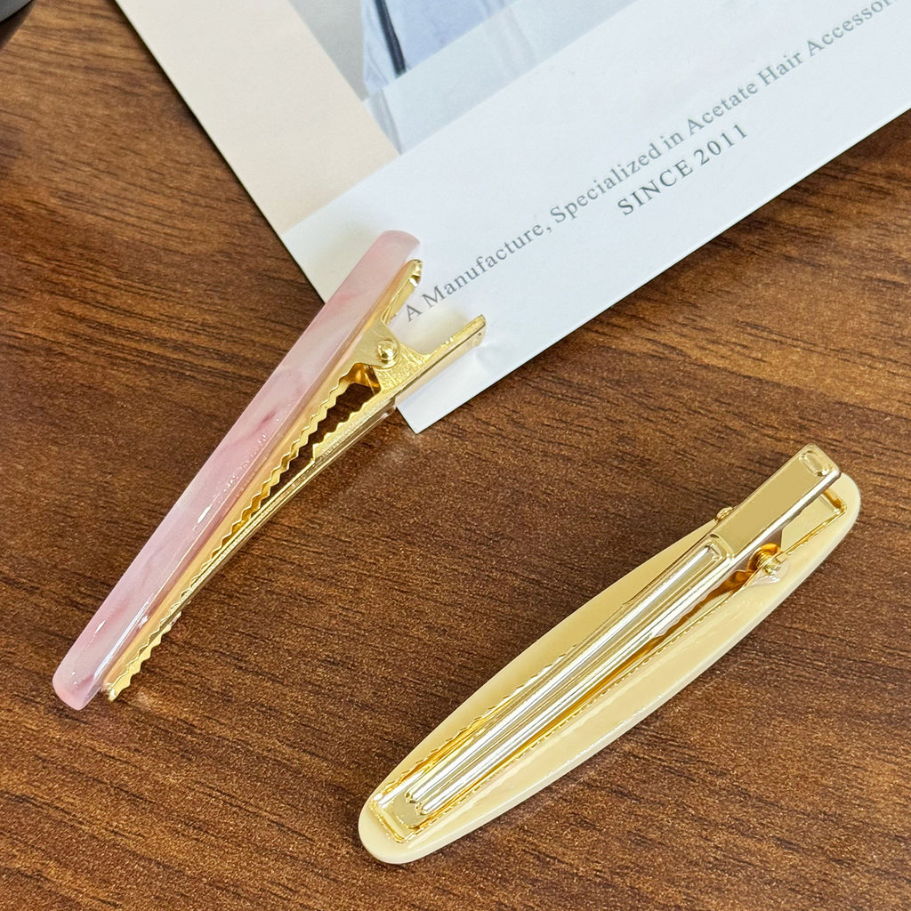 Elliptical straight clip hair claw