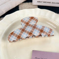 brown and blue plaid hair claw