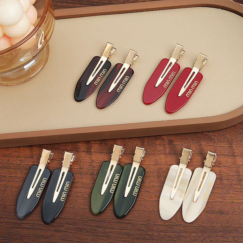 Solid-color seamless hair clip for makeup application