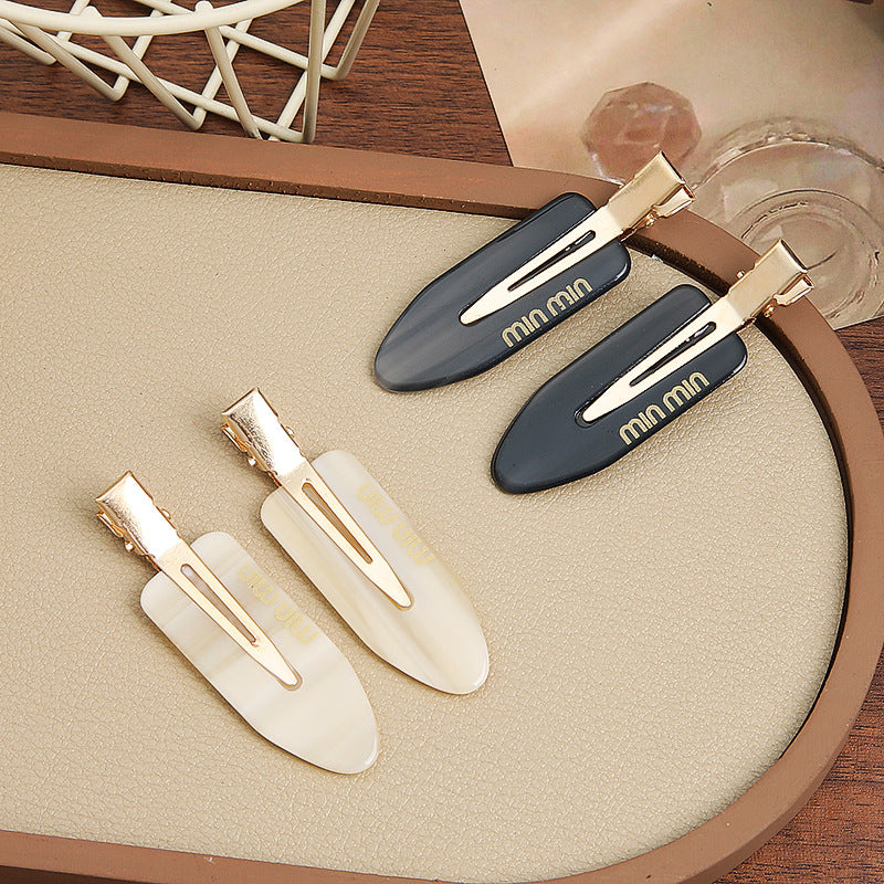 Solid-color seamless hair clip for makeup application